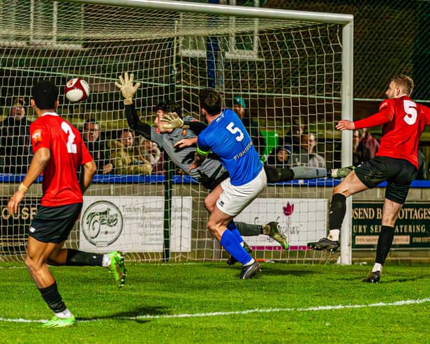 Town skipper Dan Rowe heads in the late leveller, although FC United of Manchester scored an even later winner. PHOTOS: BRIAN MURFIELD