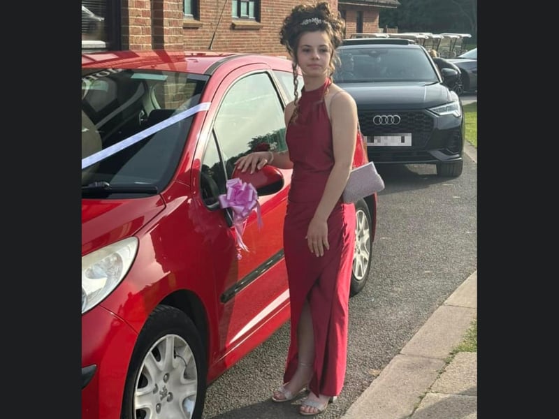 The gorgeous red car matches Leah's equally gorgeous red dress.