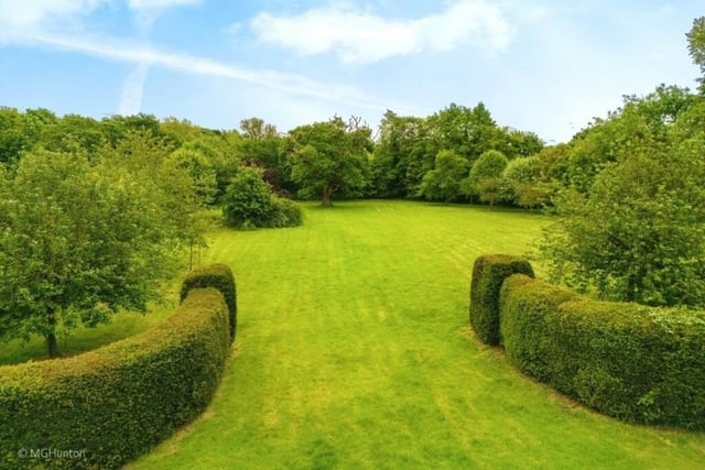Gardens and grounds of 1.94 acres stretch in front of the farmhouse.