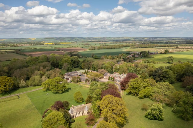 St Edmund's Church is seen in the foreground of this photograph looking over the Hall and grounds to the Yorkshire wolds beyond.