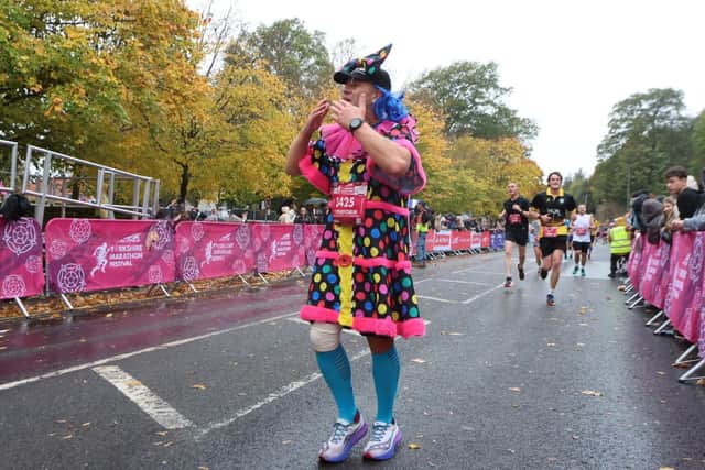 Stephen Blackford, who ran the course dressed as a pantomime dame, is raising funds for Y Perform in Scarborough