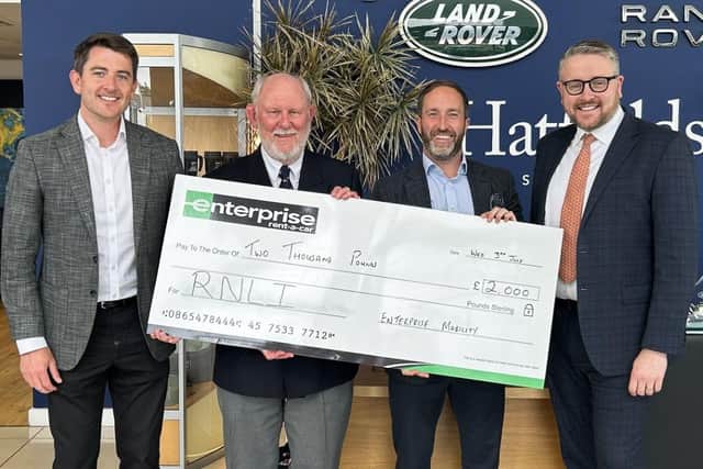Mike Major is presented with the cheque from Enterprise by Danny Flynn, Replacement Sales Manager, Northwest & Midlands and Chris Brown, Head of Replacement Sales, Northwest & West Midland. Also present was Craig Petty, Sales Director for Hatfields Jaguar Land Rover.