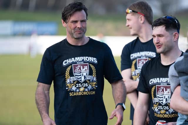 Scarborough RUFC Head Coach Ben Foden celebrates the title win with his players. Photo by Andy Standing