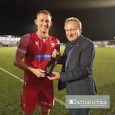 Former Scarborough FC boss Neil Warnock, right, presents the Betton Wines Man of the Match award to Athletic's Ash Jackson after the 2-2 draw with Bradford PA