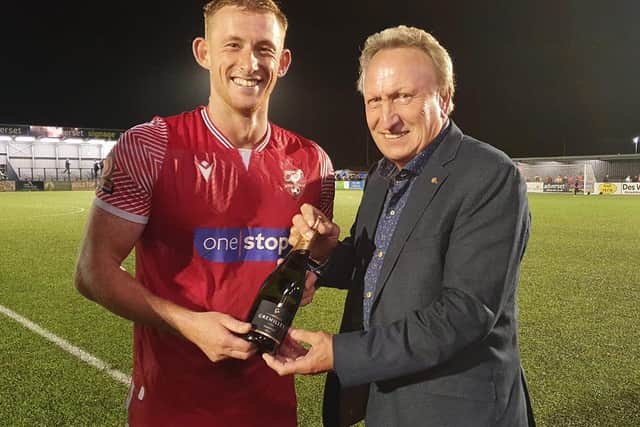 Former Scarborough FC boss Neil Warnock, right, presents the Betton Wines Man of the Match award to Athletic's Ash Jackson after the 2-2 draw with Bradford PA