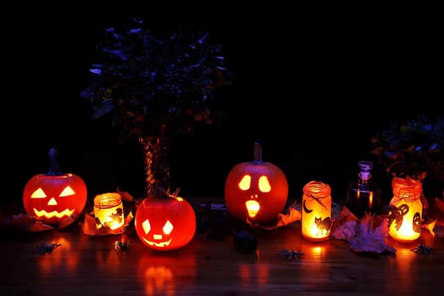 All aglow: candles are a Halloween must.