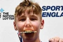 Scarborough ABC boxer Danny Kelwick shows off his gold medal.