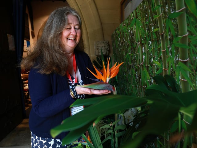 Helen tends to her display