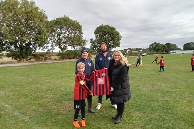 West Pier Reds receive their new kit from sponsors