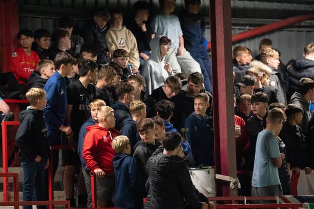 The Brid Town fans take in the midweek action. Photo by Wandering Photography