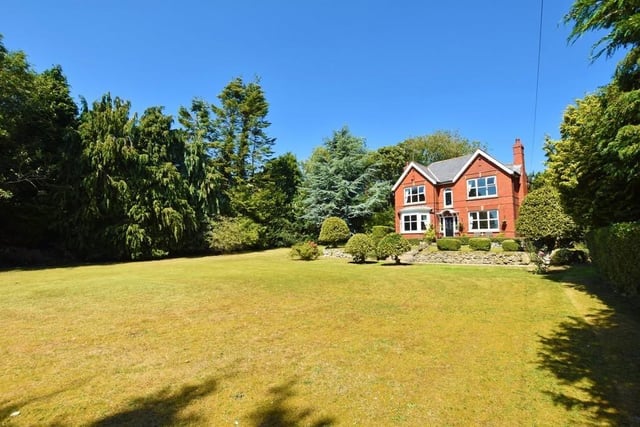 This detached grand residence is set in beautiful grounds with extensive lawns at both the front and rear of the property
