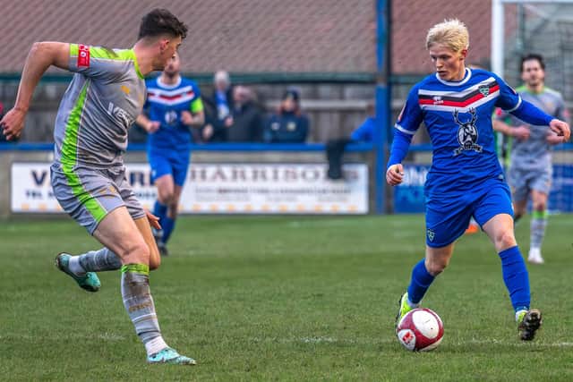 Max Howells in action for Town against Gainsborough.  PHOTOS BY BRIAN MURFIELD