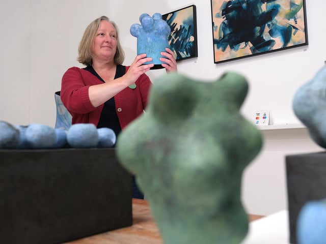 Kaitie Braida with her ceramic designs.