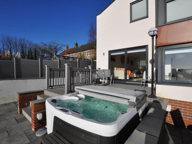 The house has plenty of outdoor seating and entertainment areas.