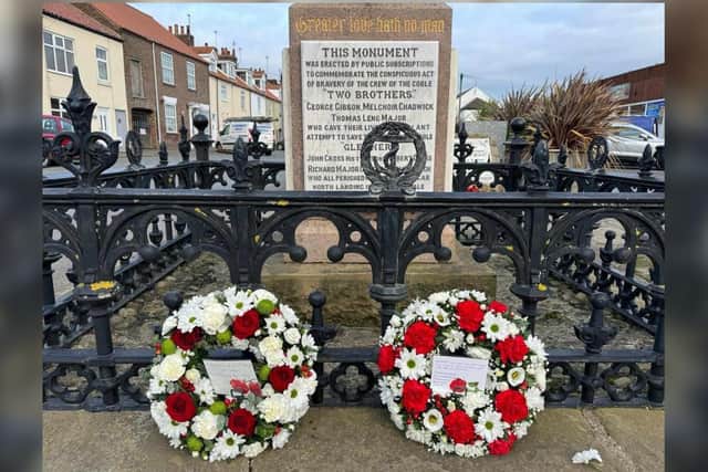 Standing in silence for the wreath-laying ceremony. Photo by Mark Smales