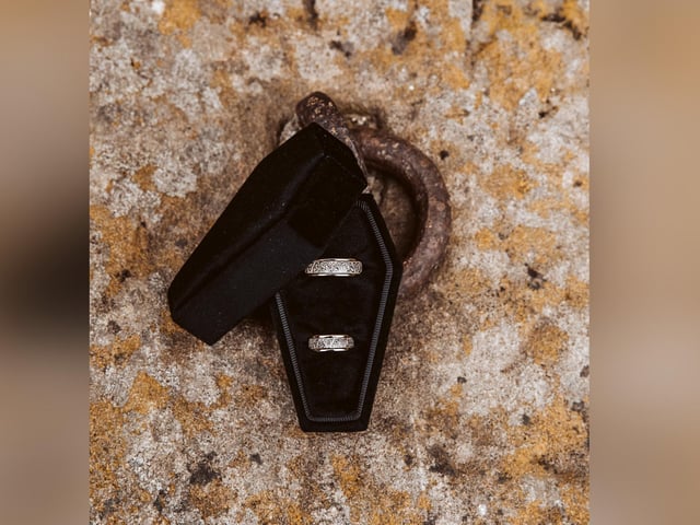 Wedding rings in a coffin-shaped box.
