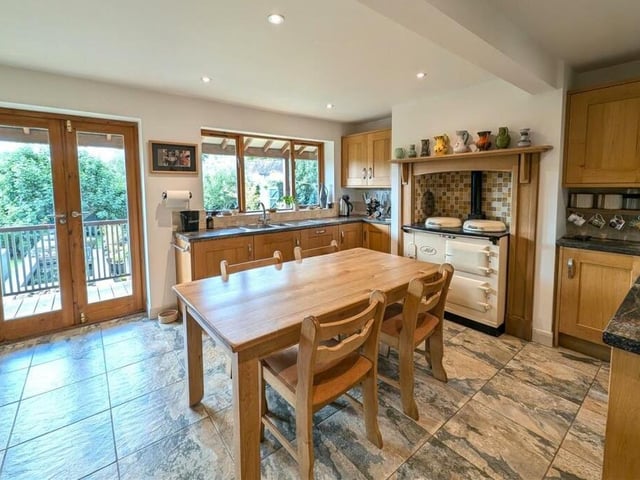 The kitchen and breakfast room, with an Aga, has doors out to the verandah.