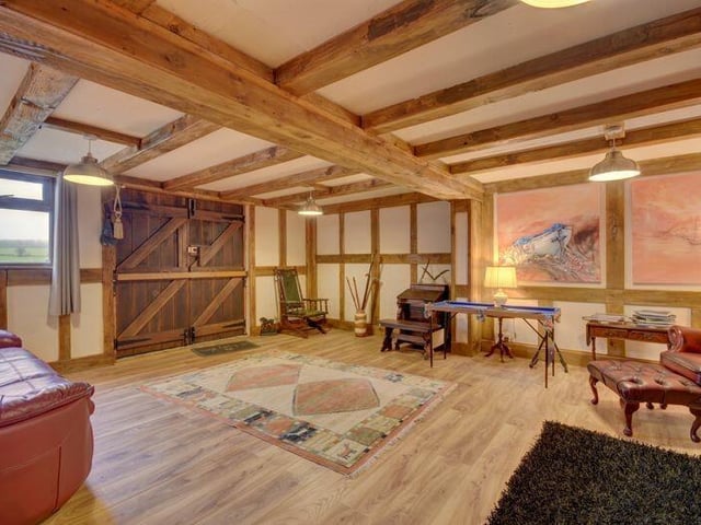 A versatile and spacious beamed room.