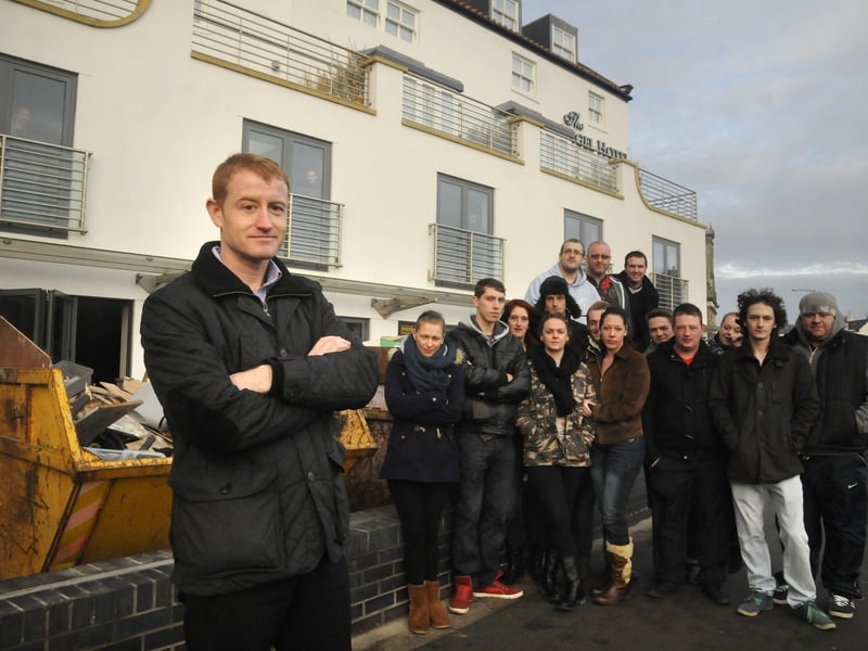 Manager Phil Tindle and his staff outside The Angel Hotel in Whitby which temporarily closed in 2013 due to flood damage.
