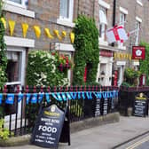 Flags displayed at the White Rose Hotel in Askrigg. (Pic credit: Tony Johnson)