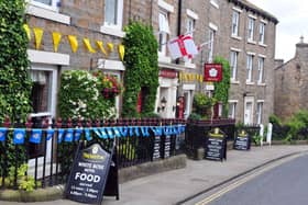 Flags displayed at the White Rose Hotel in Askrigg. (Pic credit: Tony Johnson)