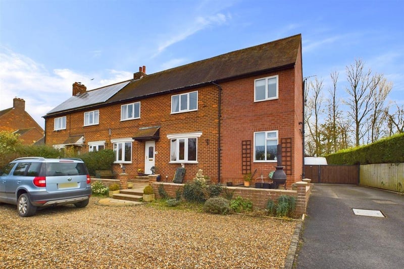 This three bedroom semi-detached house is for sale with Woolley & Parks for £240,000.