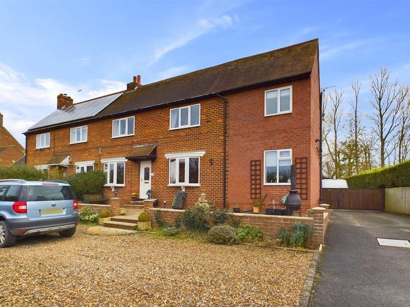 This three bedroom semi-detached house is for sale with Woolley & Parks for £240,000.