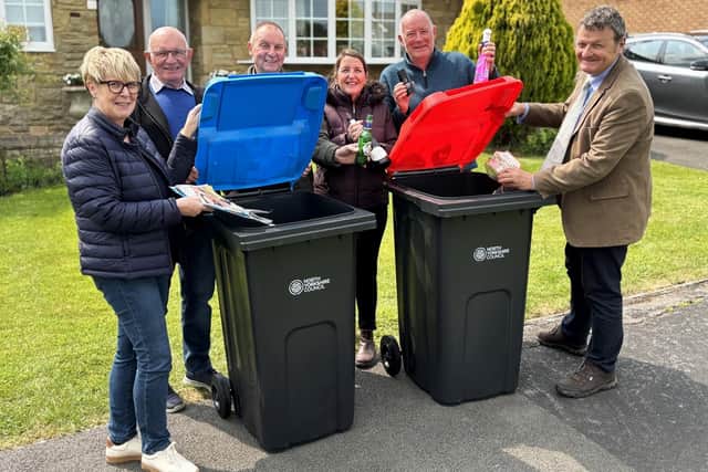 Cllr Greg White and Kirkbymoorside residents. The new bins are being delivered in the former Ryedale area as part of the first phase of a countywide roll-out.