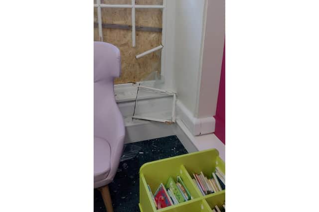 Damage caused to a window at the library.