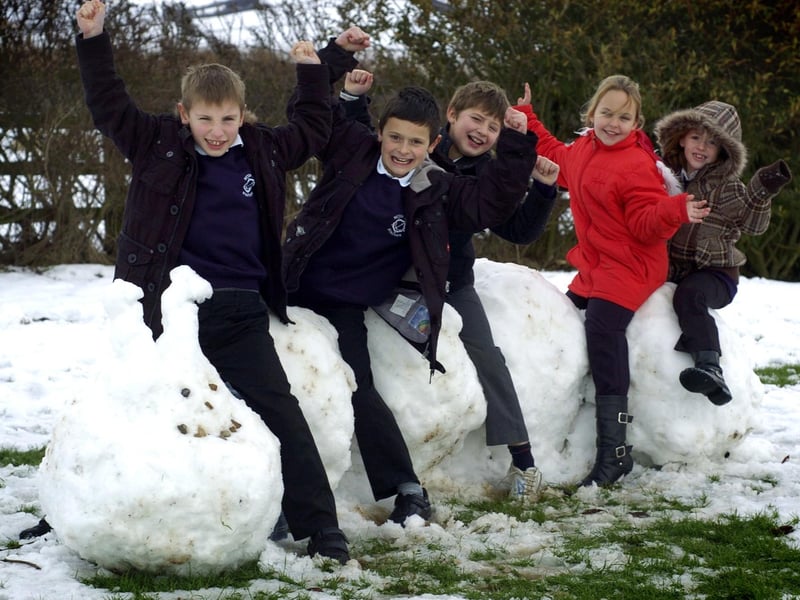 Snow creations at Seton Primary School, Staithes. Pupils are pictured seated on a snow caterpillar they have made.