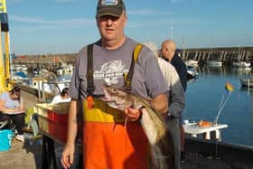 Scarborough Angling Festival treasurer Martin Eves shows off the 9lb 4oz ling that won the Superpool at Tuesday's Vice Admiral of Yorkshire Coast Challenge Trophy match.
