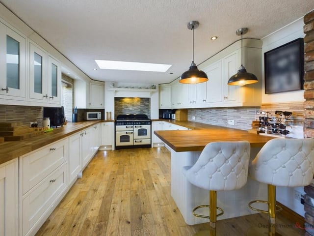 The stunning kitchen with breakfast bar.