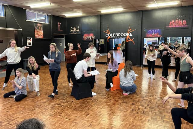 Choreographer Amber Newton putting Prince Eric (Ryley Jarvis) and Ariel (Violet Jellings) through their moves.