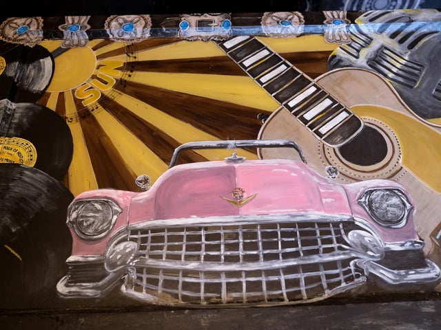A painting of one Helen's favourite cars - a pink Cadillac