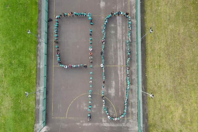 Pupils at Thomas Hinderwell Primary Academy form the number 90 in the school playground to celebrate the school's 90th anniversary