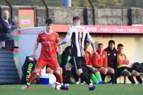 Brid's Sam Leverett is closed down by a Heaton Stannington player.