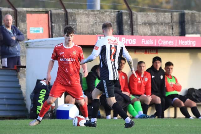 Brid's Sam Leverett is closed down by a Heaton Stannington player.