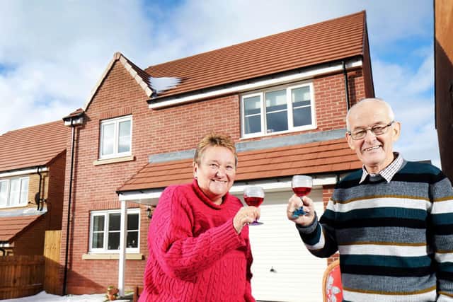 Graham and Janet Beevers outside their new home.