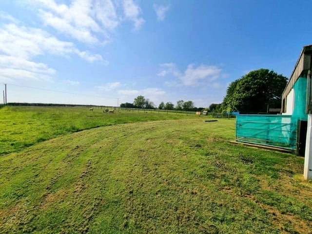 The property has a 1.5 acres plot that includes a paddock.