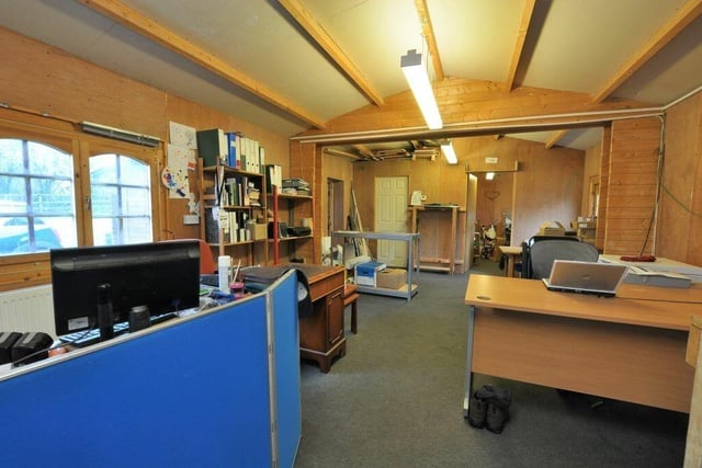 A large log cabin is part of the property, and makes an ideal home office or workshop.
