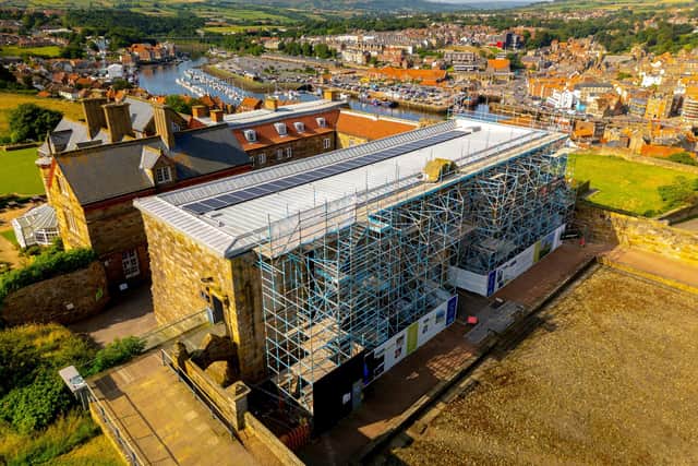 Solar panels on the roof of the visitor centre at Whitby Abbey.