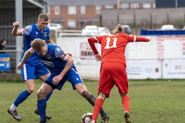 Town's Matt Broadley pushes forward at Pontefract.