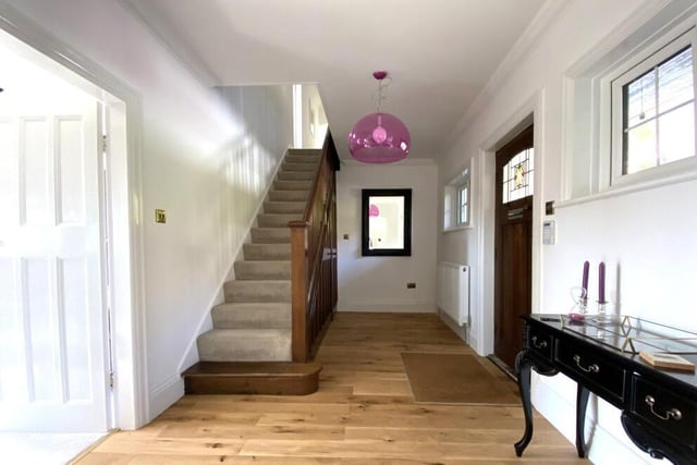 The hallway has under stairs storage.