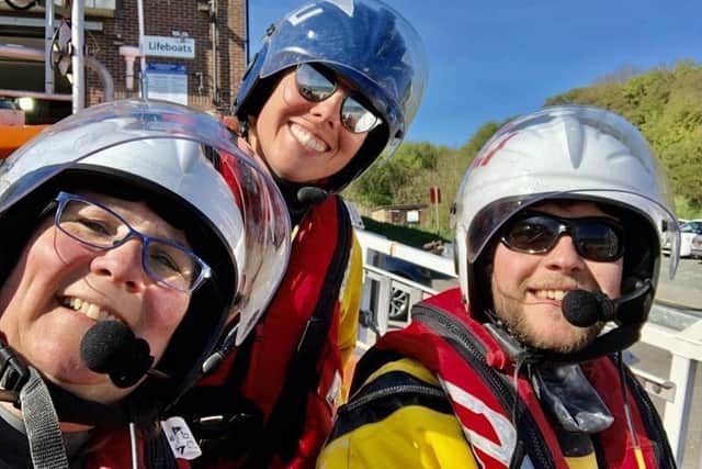 Sophie Wiles and Greg Stokes with assessor Anna Heslop after passing out as navigators. Photo: RNLI/John Bates