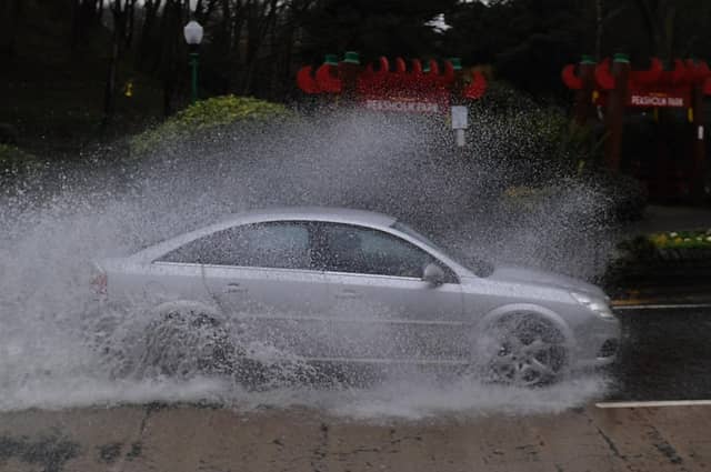 Cars drive the flooded road on Burniston Road, Scarborough, as Storm Ciara takes hold.
Picture by Simon Hulme