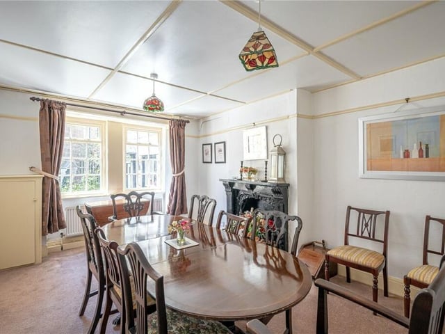 The formal dining room, with period fireplace.