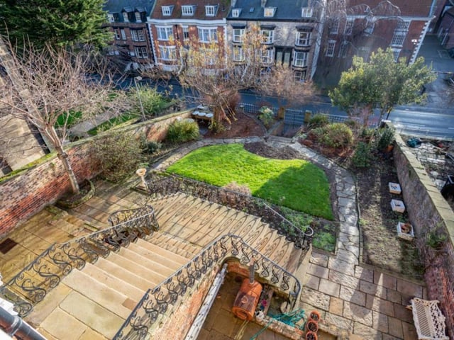 Looking down over the impressive flight of steps that lead to the front door of the house.
