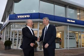 Clive Brook hands over showroom keys to Ray Chapman Motors.