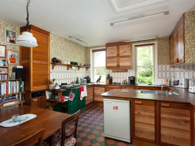The kitchen with breakfast room has an oil-fed green Aga.