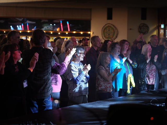 Crowds enjoy the music.